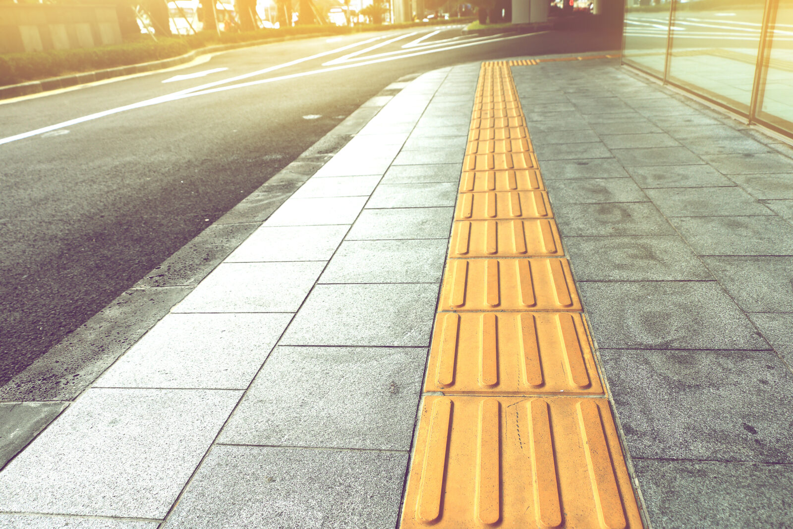 Tactile paving for blind handicap on tiles pathway, walkway for blindness people.